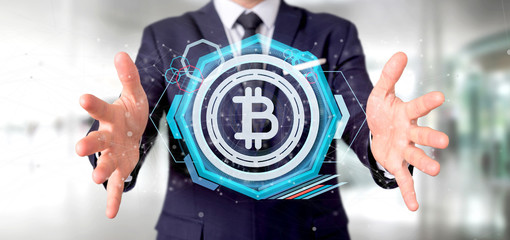 Poster - Man holding a technology Bitcoin icon on a circle 3d rendering