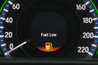 © Khunatorn - Close up empty Petrol, gasoline gauge dash board in car with digital warning sign of run out of fuel turn on on black background. Low level of fuel show on speedometer dashboard.Odometer Day