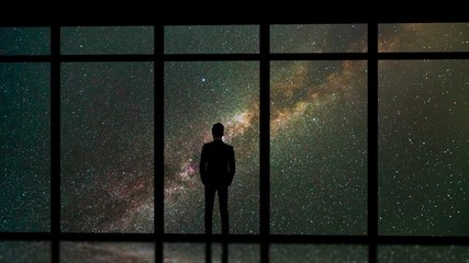 Wall Mural - The man standing near windows on the meteor shower background. time lapse