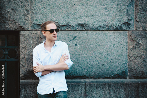 Fotografie, Obraz Young and cool long hair man at the street