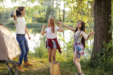 attractive travelers are dancing on the hiking tour. beautiful awesome landscape on the background of the photo