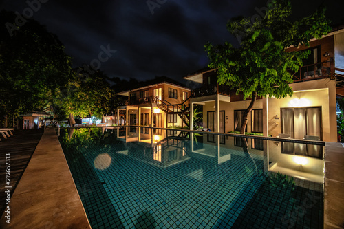 Long Exposure Night Shot Image Of Poolside Resort Building