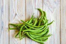Bunch Of Freshly Picked Green Beans On A Wooden Surface