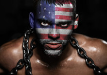 American Flag On The Face Of A Young Man In Chains