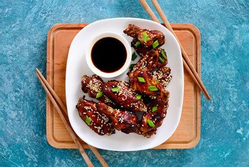 Wall Mural - Chicken wings cooked on asian style recipe