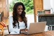 © Daniel Ernst - African american woman with long hair working at computer