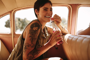 Hipster girl traveling by car