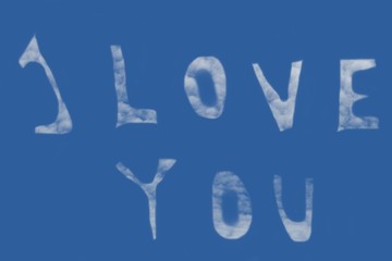 The I LOVE YOU inscription in the sky created from clouds.Lettering I LOVE YOU creates clouds in a blue sky.