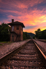 Summer Sunset Over Old Control Tower And Train Tracks