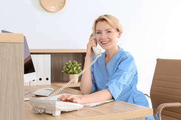 Sticker - Female medical assistant at workplace in clinic. Health care service