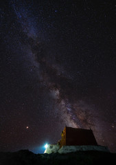 Wall Mural - vertical landscape, night sky full of star and milky way with antique temple at rangdum monastery in