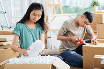 Young Asain couple getting ready to move out