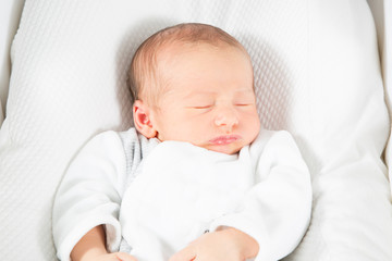 Wall Mural - newborn baby sleeping on a white blanket