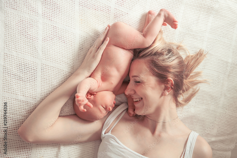 happy motherhood concept - happy mother and newborn baby - obrazy, fototapety, plakaty 