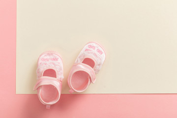 Wall Mural - Baby girl shoes on pastel colors background