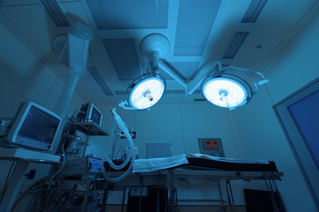 Wall Mural - equipment and medical devices in modern operating room take with art lighting and blue filter