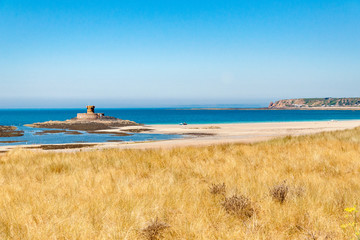 La Rocco tower and St Ouen's bay on the island of Jersey