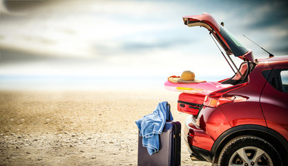 Canvas Print - Autumn trip with red car and sea landscape 