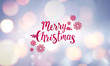 © Laura Pashkevich - Winter snowy blurry background in light blue pink tones. Falling defocused snow with beautiful light, abstract snowflakes in blur and inscription of Merry Christmas.