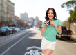 travel, tourism and photography concept - smiling teenage girl with vintage film camera over san francisco city street background