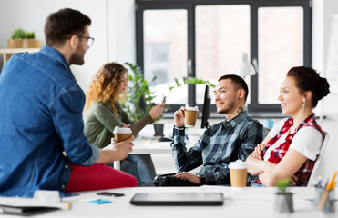 Sticker - business and people concept - happy creative team drinking coffee at office