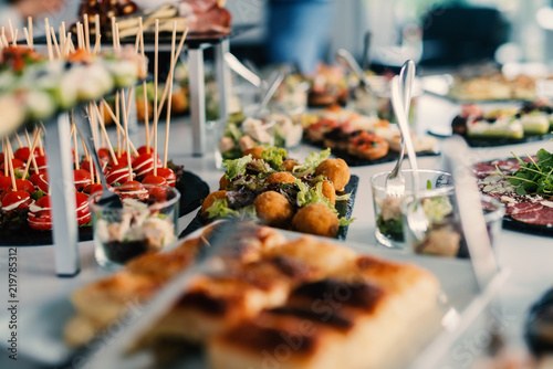 Cuadros en Lienzo Table full of tasty food beautifully decorated.