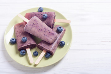 Popsicle with blueberries and yogurt