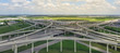 Panorama horizontal aerial Interstate 10 or Katy freeway massive intersection, stack interchange, elevated road junction overpass cloud blue sky. Top view metropolitan area of Katy, Texas, USA
