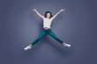 © deagreez - Crazy attractive pretty stylish trendy nice lovely cheerful curly-haired brunette girl in casual white t-shirt and jeans, flying up in air like star figure, isolated on grey background