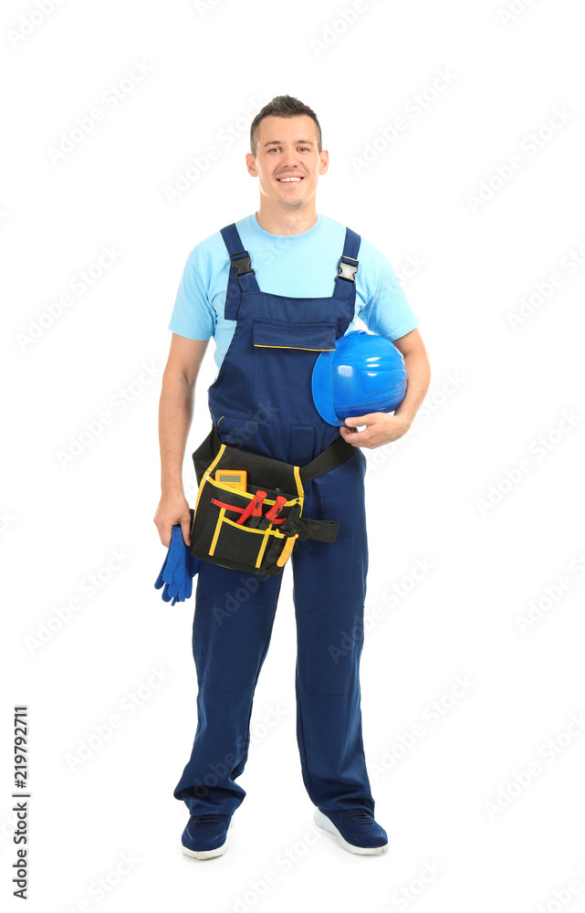 Electrician with tools and helmet on white background
