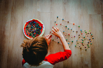 Wall Mural - child making geometric shapes, engineering and STEM education