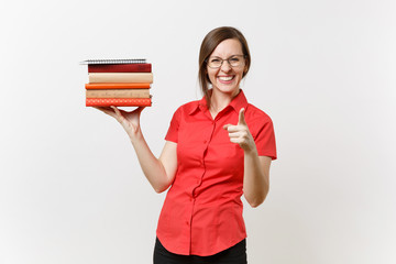 Portrait of beautiful young business teacher woman in red shirt glasses holding stack text books in hands isolated on white background. Education or teaching in high school university concept.