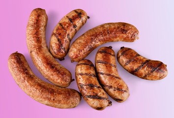 Wall Mural - Roasted sausages on white background