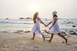 © Maygutyak - two sisters having fun at the sea at the sunset