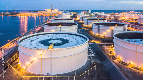Fotografía Aerial view oil terminal building with boat background is industrial facility for storage of oil and petrochemical products ready for transport to further business storage
