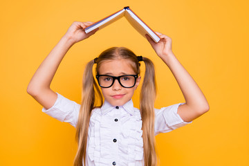 Poster - Omg! Back to school! Close up photo portrait of sweet lovely upset sad girt covering head with opened notebook holding above head wearing white stylish blouse isolated bright background