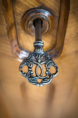 Fototapete - Old key in keyhole, macro shot. Retro style. Concept and Idea for History, business, security background.