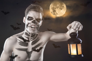 Dia de los Muerto Costume - Day of the dead is a mexican holiday. Here is a man with skull face and blurry background