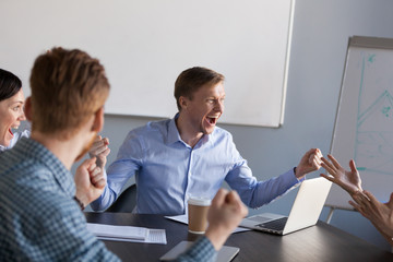 Wall Mural - Excited workers scream with happiness of shared business goal achievement, employees witness online win or company breakthrough on market, motivated businesspeople launch successful startup project