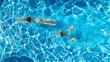 © Iuliia Sokolovska - Aerial top view of girls in swimming pool water from above, active children swim, kids have fun on tropical family vacation, holiday resort concept