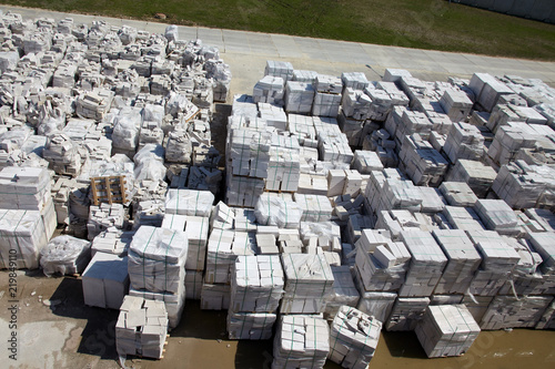Fotografia, Obraz Aerial view of autoclaved aerated concrete blocks, both defective and good, on p