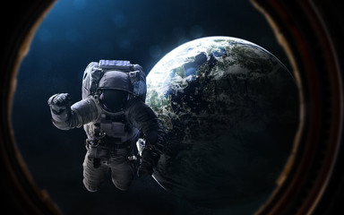 Wall Mural - astronaut and exoplanet in porthole of space ship. deep space in rays of blue star. abstract science