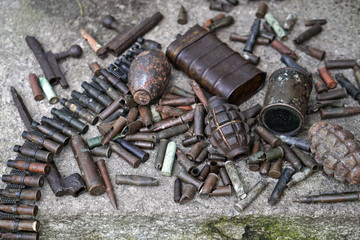 military background with cartridges of grenades and machine-gun tape. black archeology. world war ii