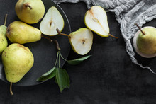 Ripe Pears In A Plate  On Dark Background