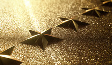 Golden Stars In High Relief. Concept Of Good Qualification.