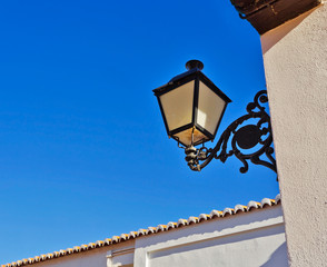 old fashioned outdoor lamp on white wall