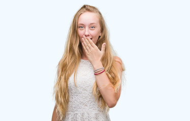 Canvas Print - Blonde teenager woman cover mouth with hand shocked with shame for mistake, expression of fear, scared in silence, secret concept