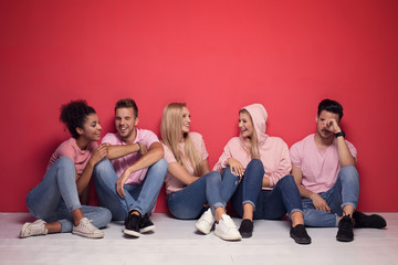 Wall Mural - Young multiracial people smiling, relaxing.