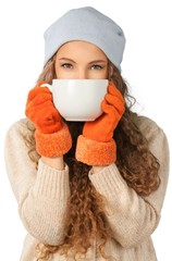 Wall Mural - Woman in hat and warm gloves holding big cup isolated on white