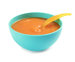 Bowl of healthy baby food on white background